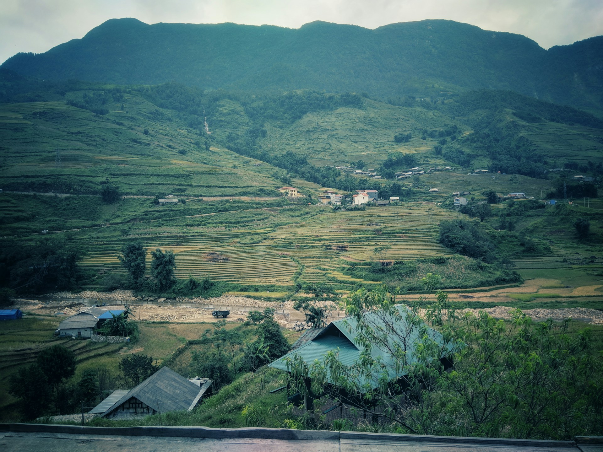 woman wearing yellow long-sleeved dress under white clouds and blue sky during daytime
