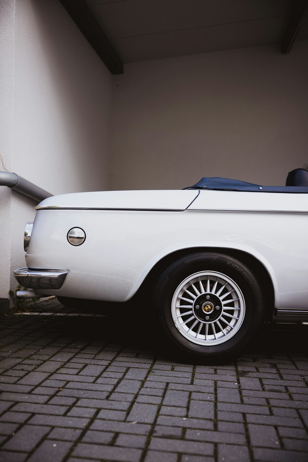 a white car parked in a garage