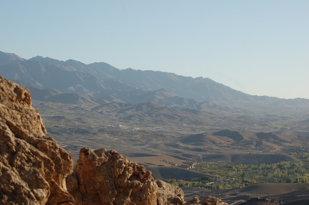 a view of a valley and mountains