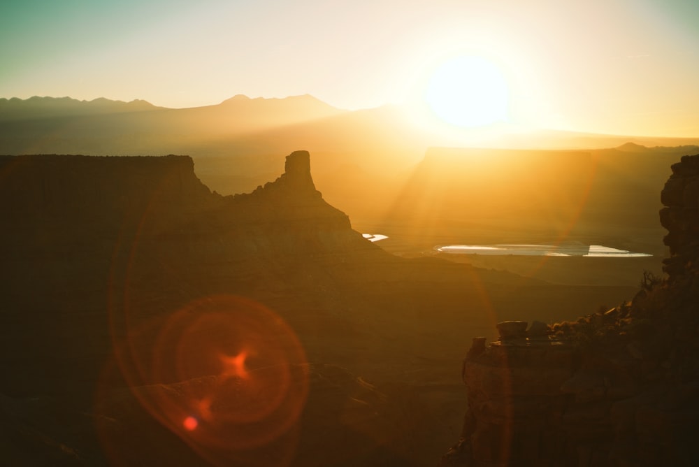 a sunset over a mountain range