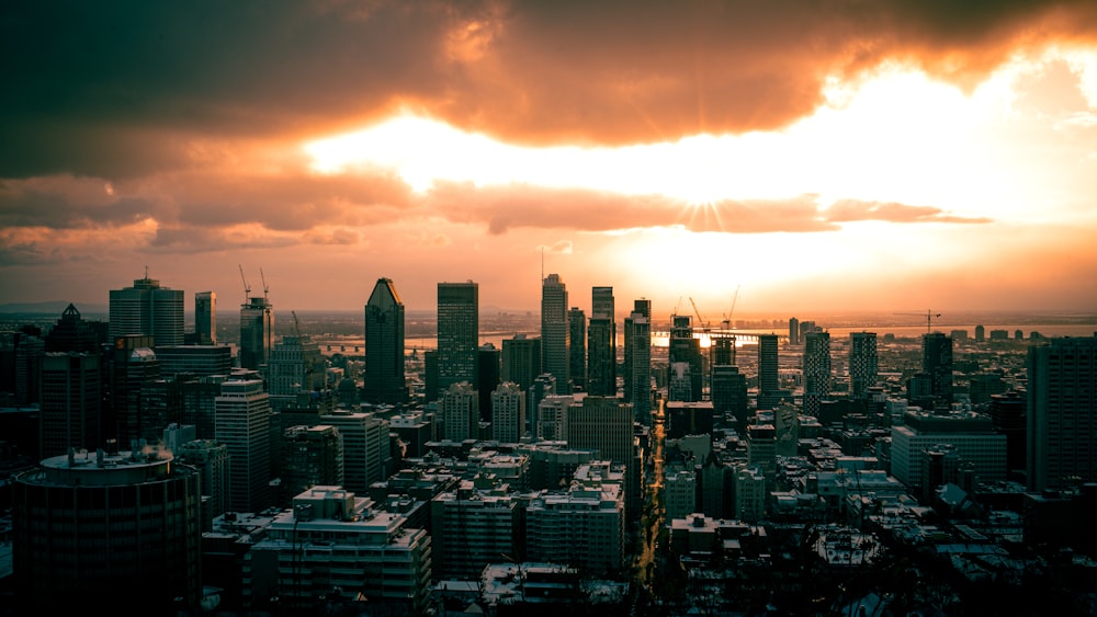 a city skyline with a sunset