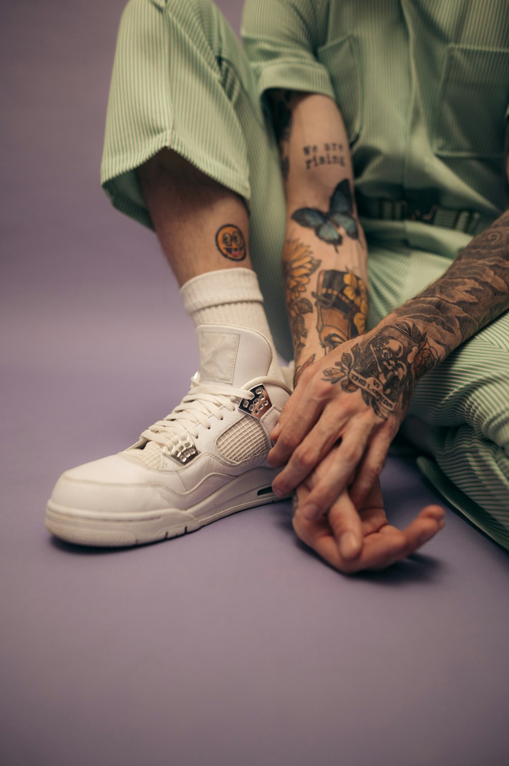a person with tattoos on their legs