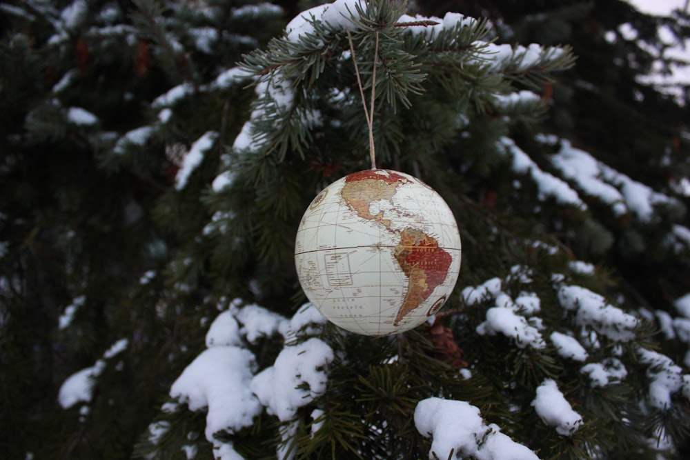 a decorated tree with a snow globe