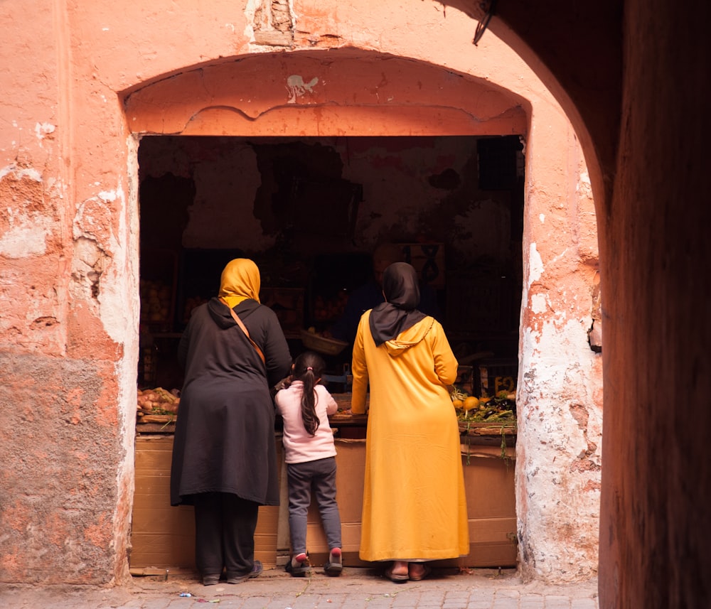 a group of people standing in a doorway
