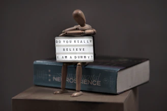 a small toy figure on a scale