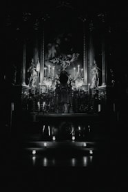 A warm, inviting altar with candles and religious icons softly lit in a cozy room.