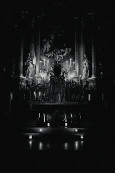 A mystical altar adorned with candles, crystals, and ancient runes glowing softly in twilight.