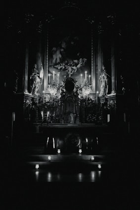 A warm, inviting altar adorned with colorful candles, herbs, and statues of Orishas in a cozy shop setting.