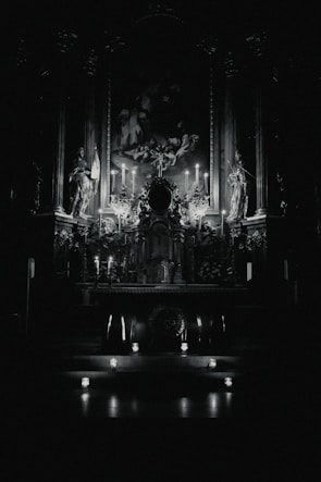 A softly lit altar with candles, crystals, and spiritual tools glowing in warm golden light.