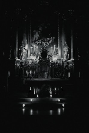 A mystical altar with glowing candles and spiritual symbols in a dark room