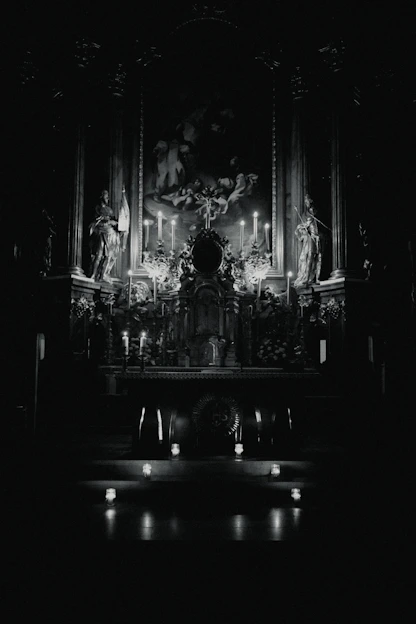 A mystical altar glowing with deep purple and navy blue hues illuminated by golden candlelight.