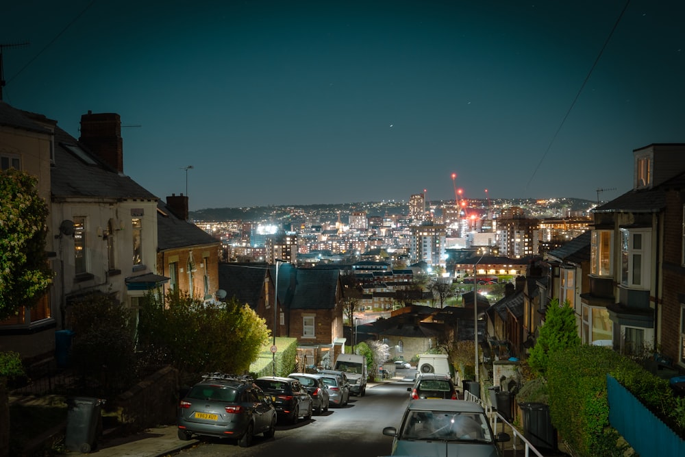 a city with cars parked on the side