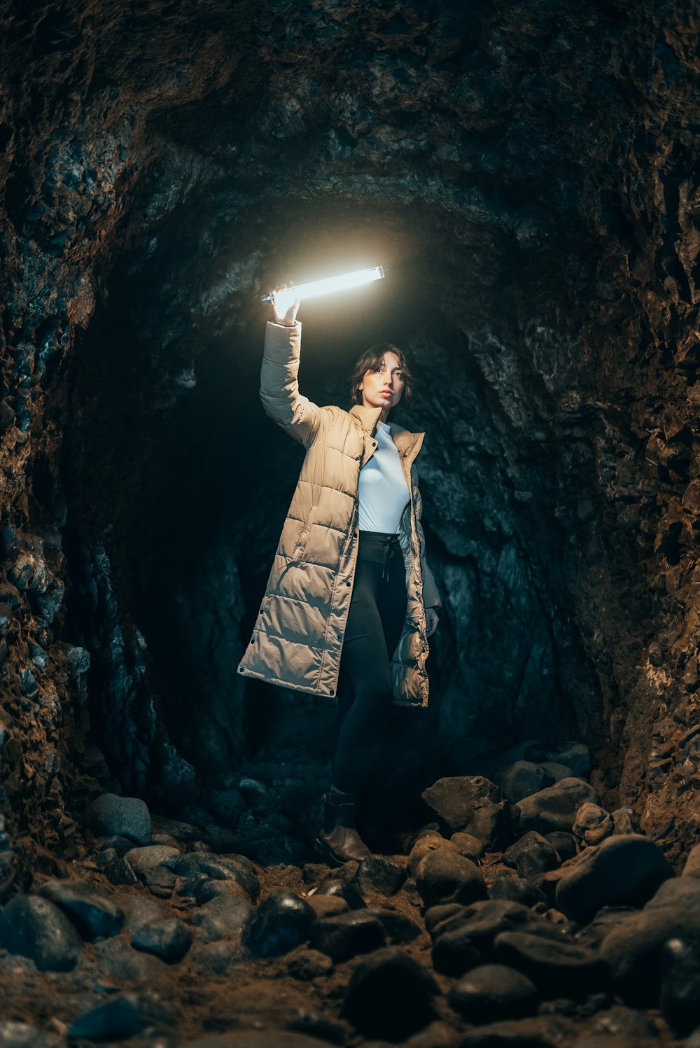 a man posing in a cave