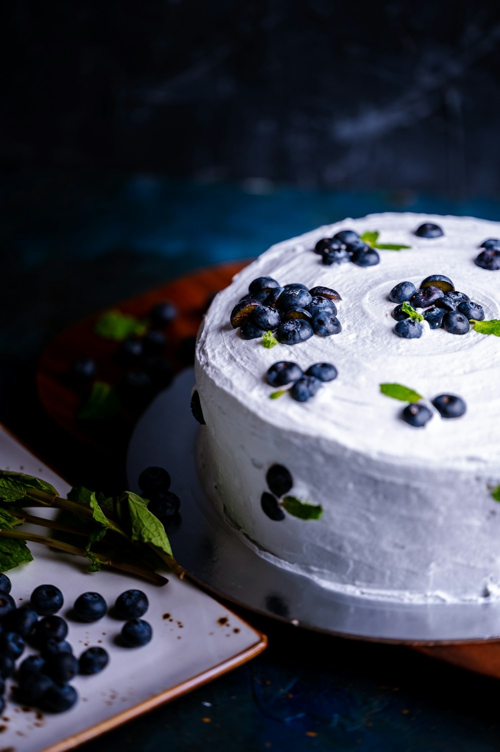 a cake with blueberries on top