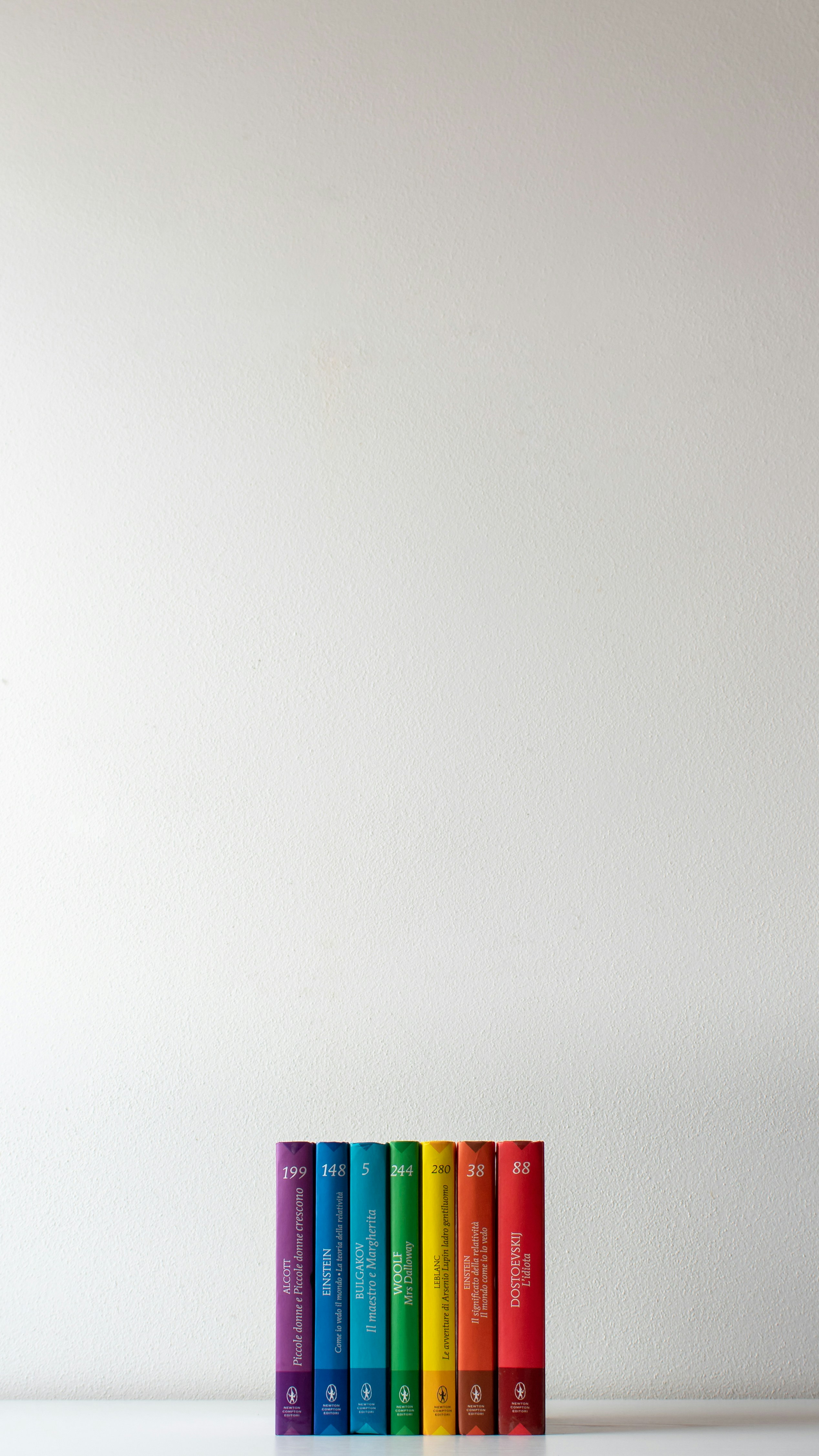 Row of colorful books with white background