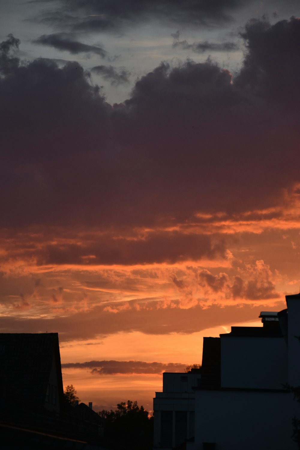 a sunset over buildings