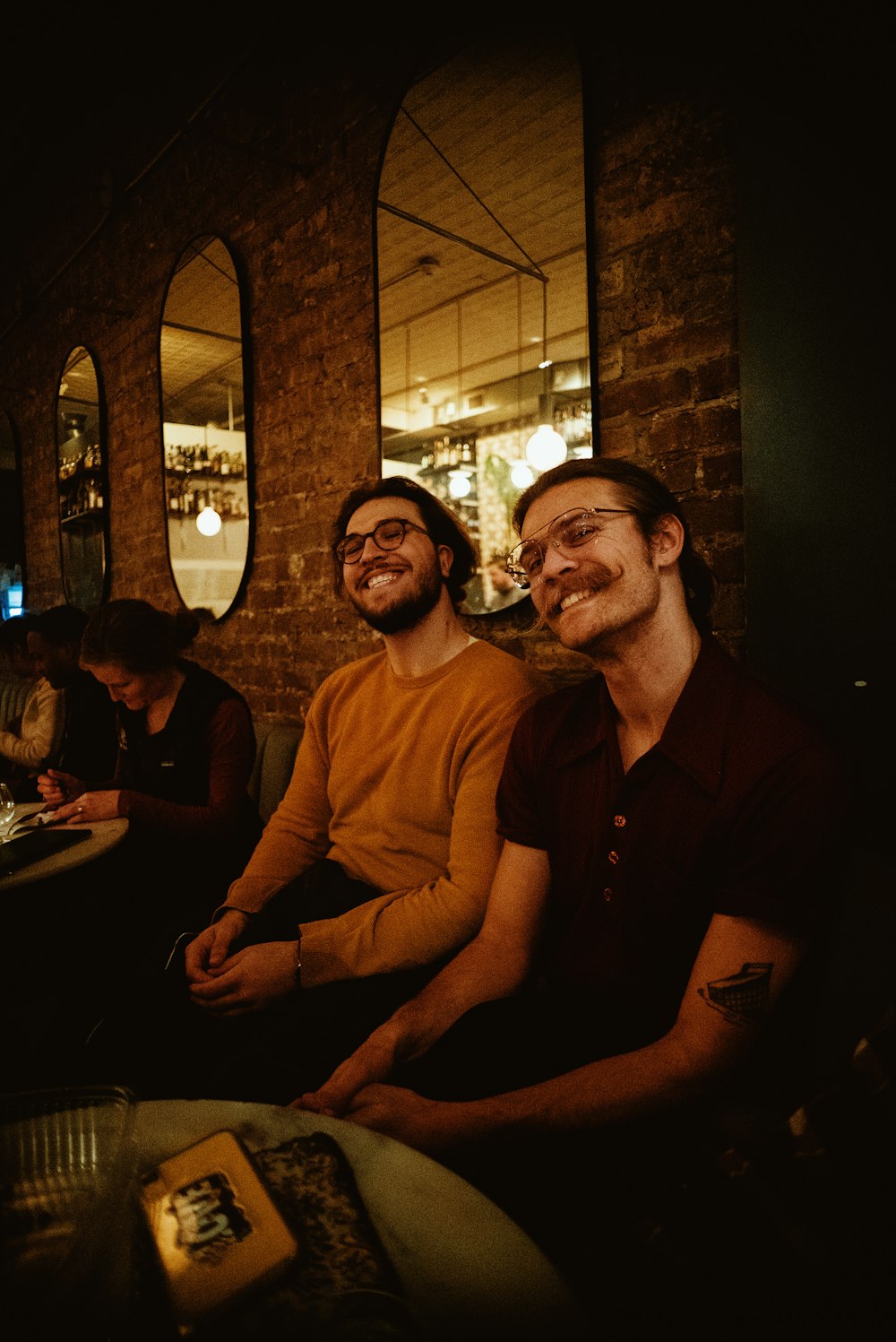 two men sitting at a table