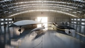 Modern aircraft hangar with Horizon Aviation branded planes and equipment.