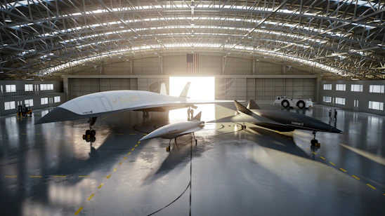 A sleek, modern aircraft hangar with technicians using tablets to manage workflow.
