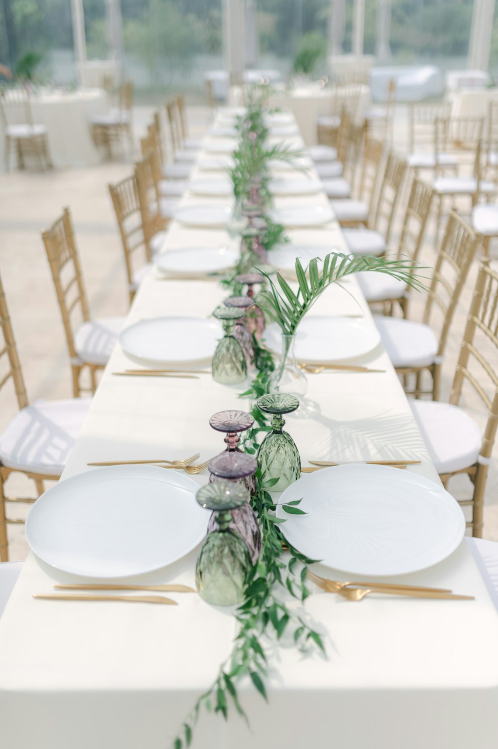 a table with plates and a plant on it