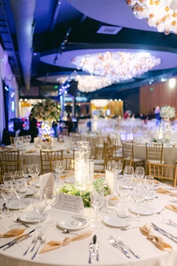 A welcoming banquet setup with elegant table arrangements and warm lighting.