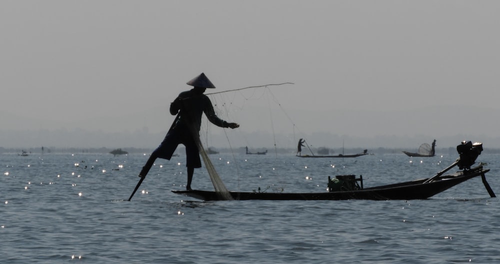 a person in a boat with a net on the front