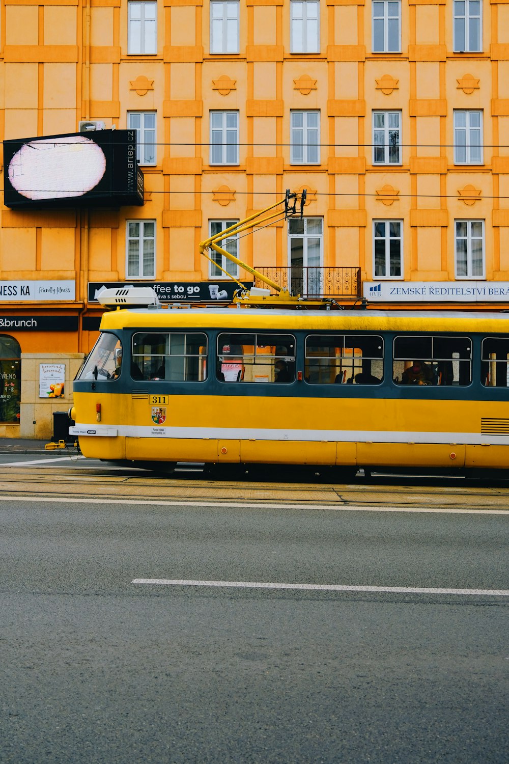 a yellow and blue trolley