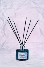 A collection of sophisticated aroma diffusers in blue tones.