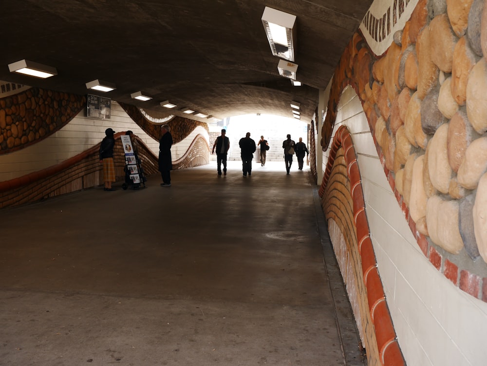 a group of people walking down a hallway