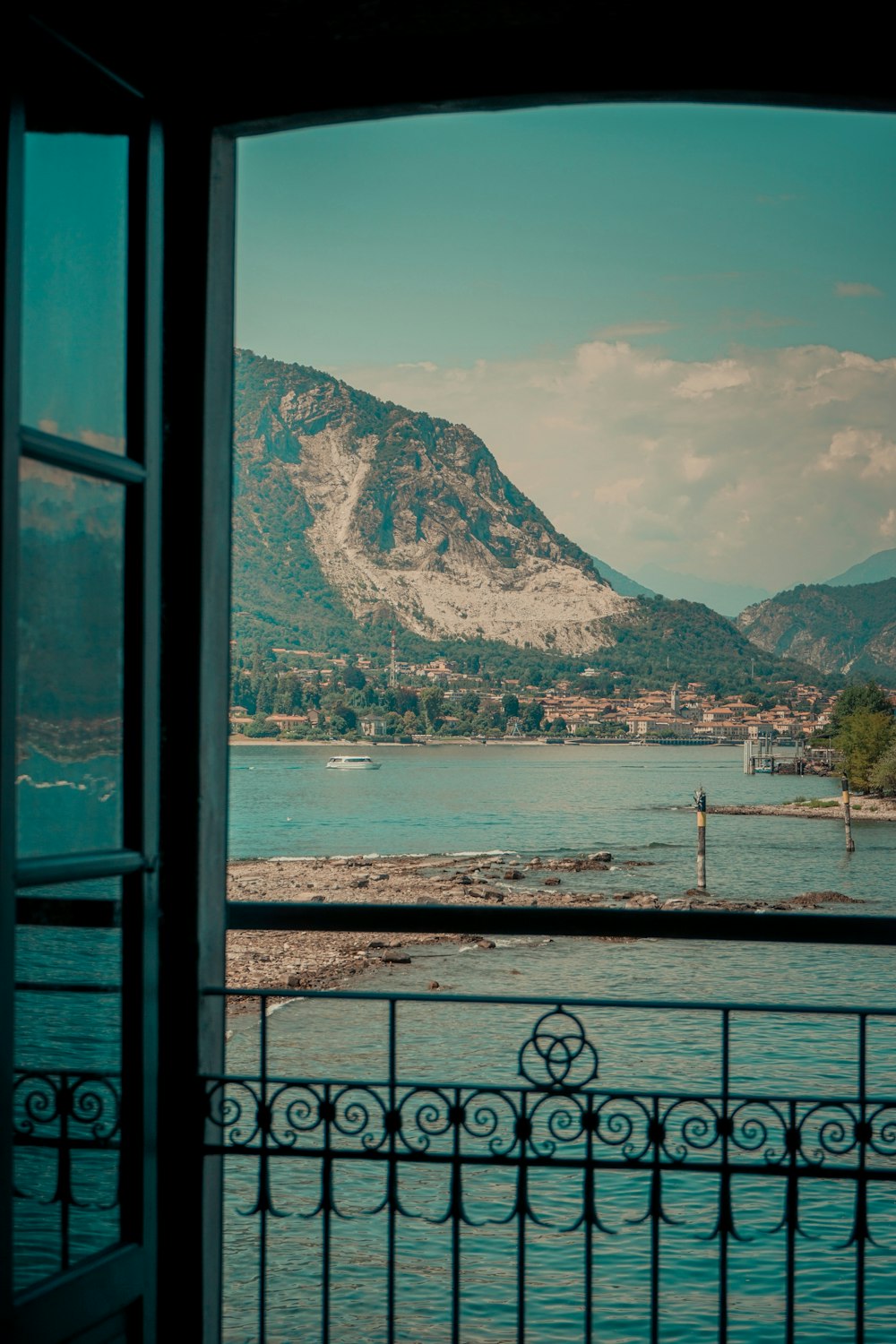 a view of a mountain and a lake from a balcony