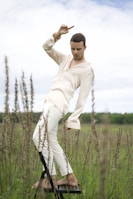 Model posing outdoors in a versatile, flowing outfit that moves with her