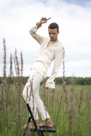Model posing outdoors in a versatile, flowing outfit that moves with her