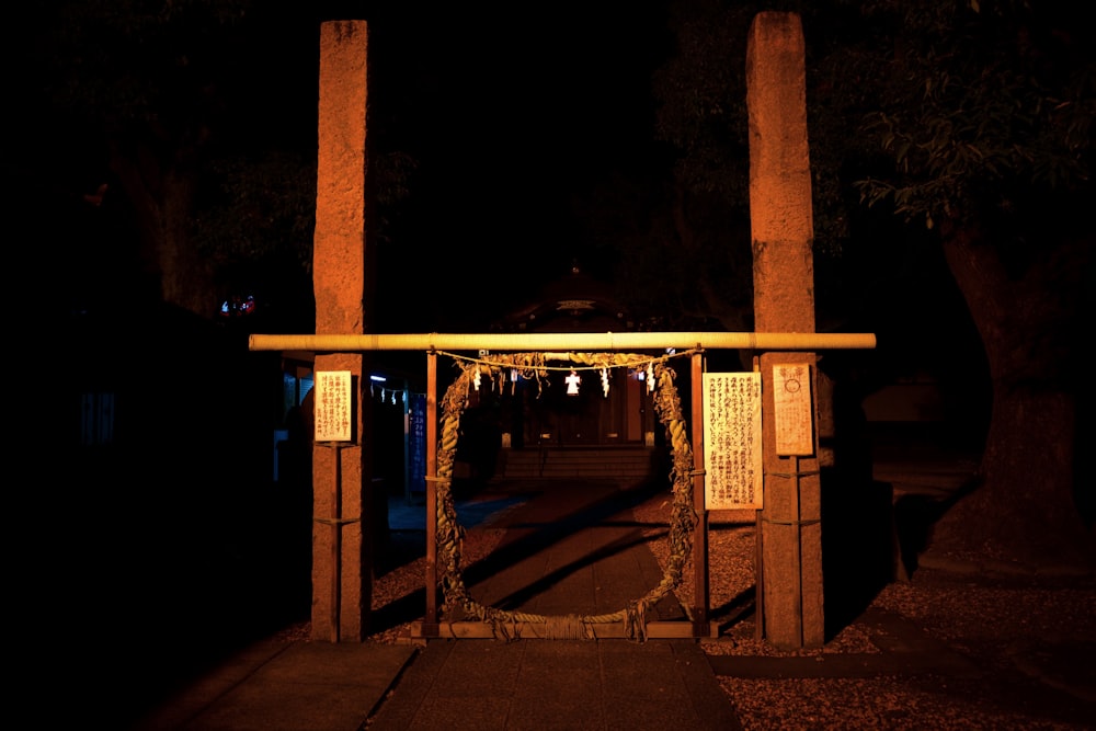 a building with pillars at night