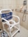 A happy client showcasing their accessible bathroom design.