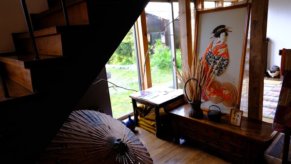 a room with a table and a vase with flowers