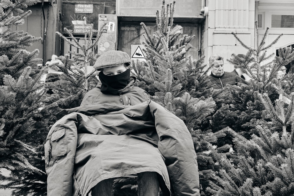 a man sitting in a chair outside