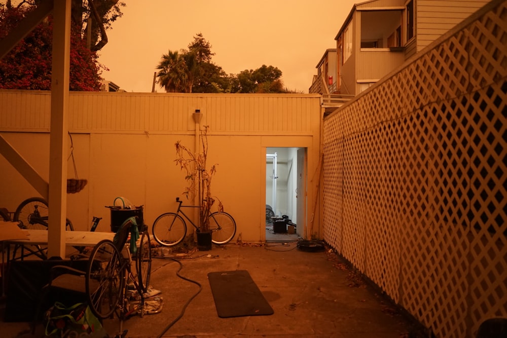 a patio with bikes and tables