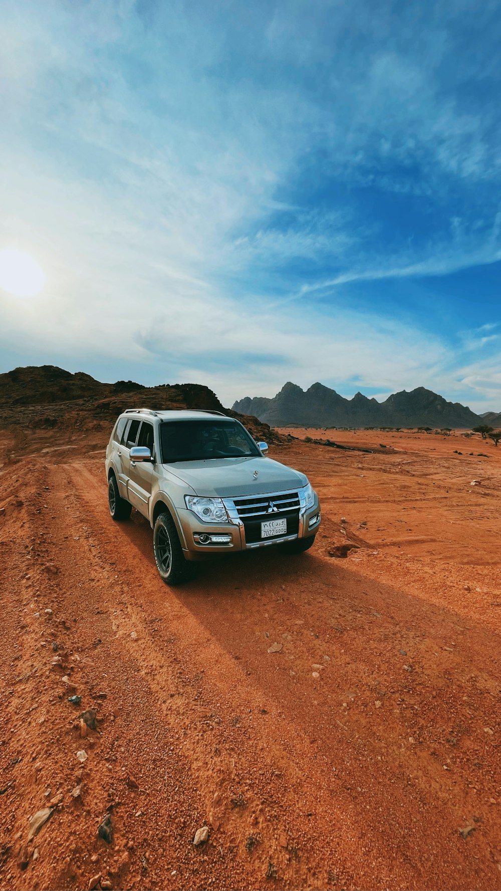 a car parked on a dirt road