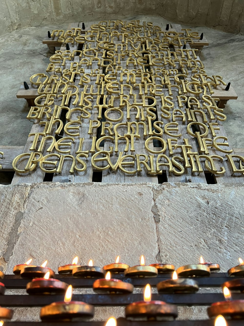 a large group of candles in a row