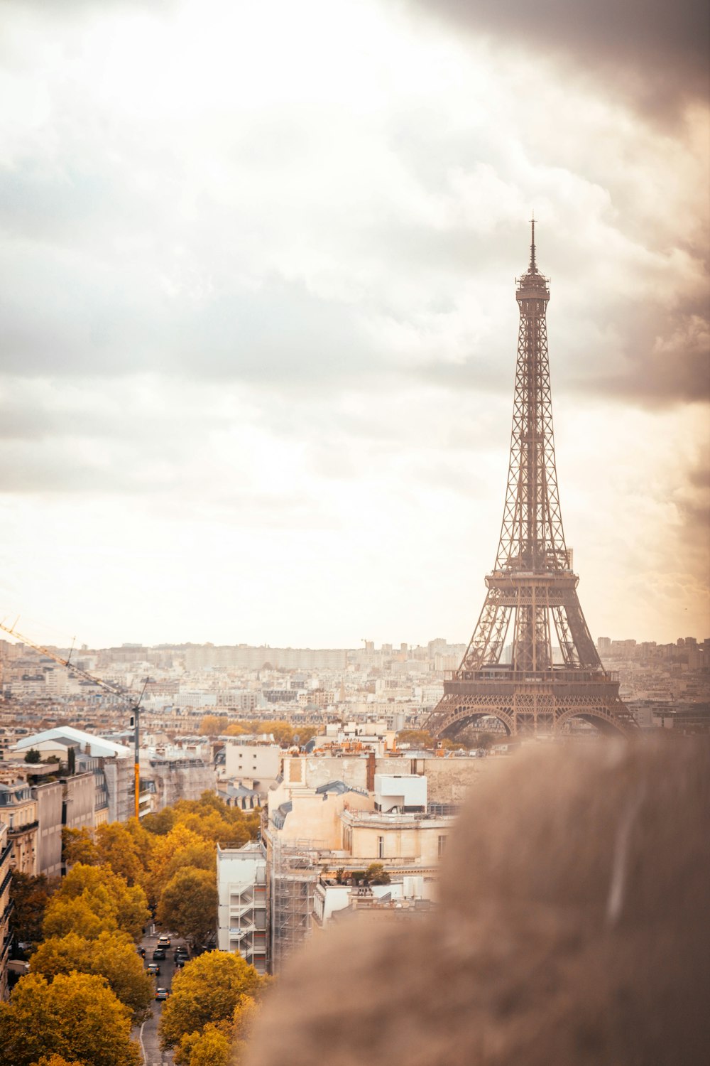 a tall metal tower in a city