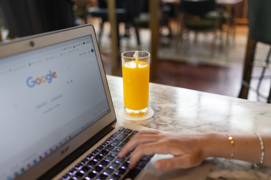 local business owner reviewing search engine rankings on laptop
