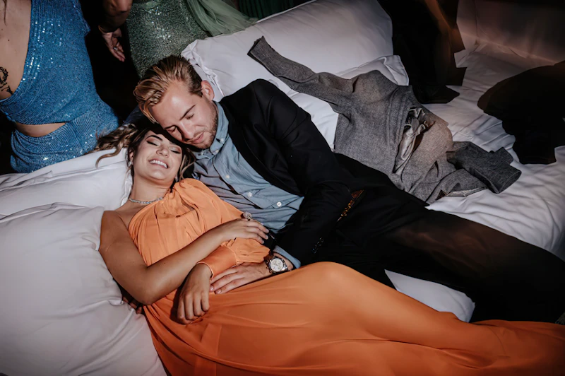 man and woman sharing an intimate bed moment