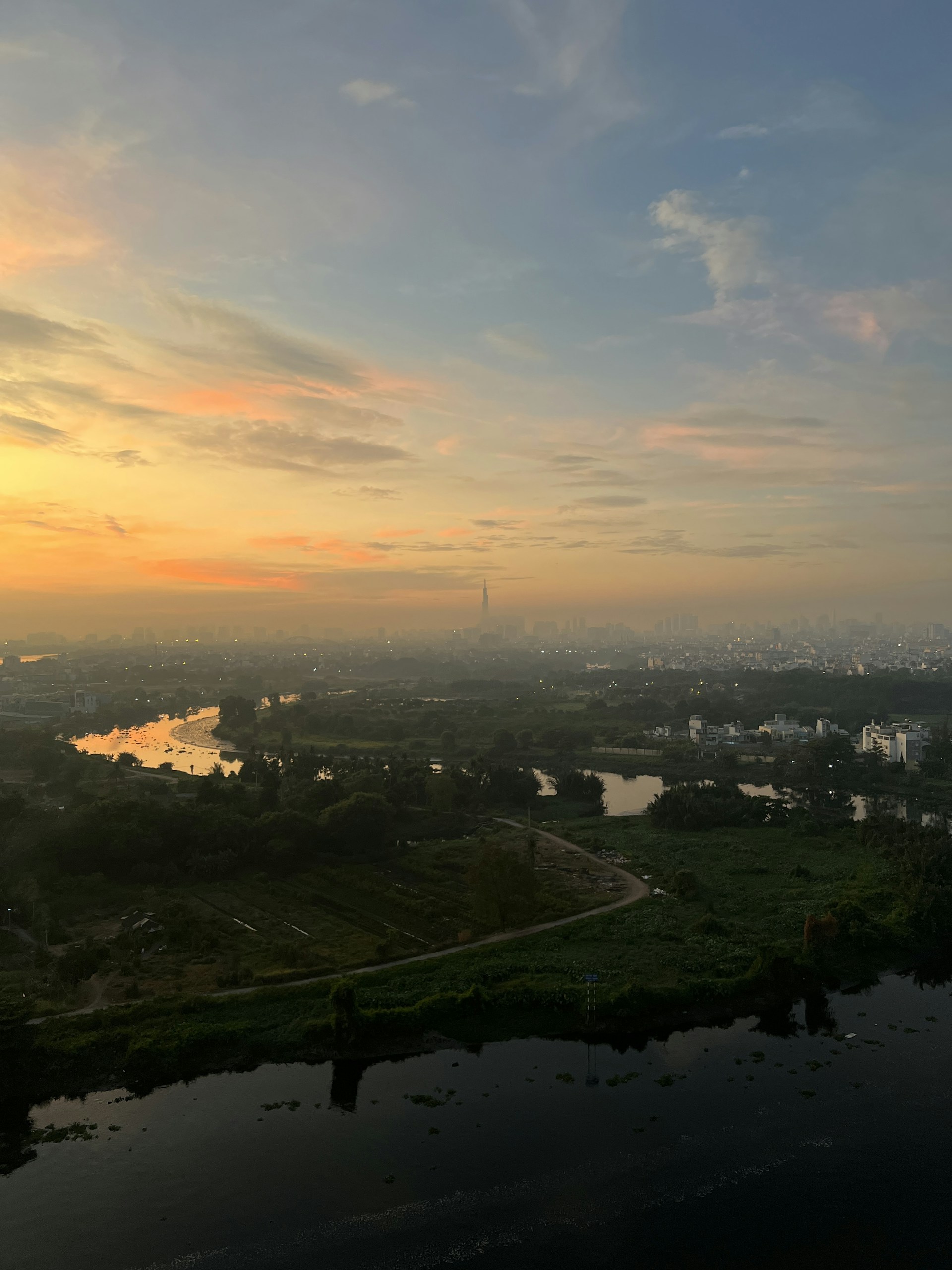 woman wearing yellow long-sleeved dress under white clouds and blue sky during daytime