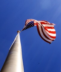 Graph showing upward growth with U.S. flag in the background.