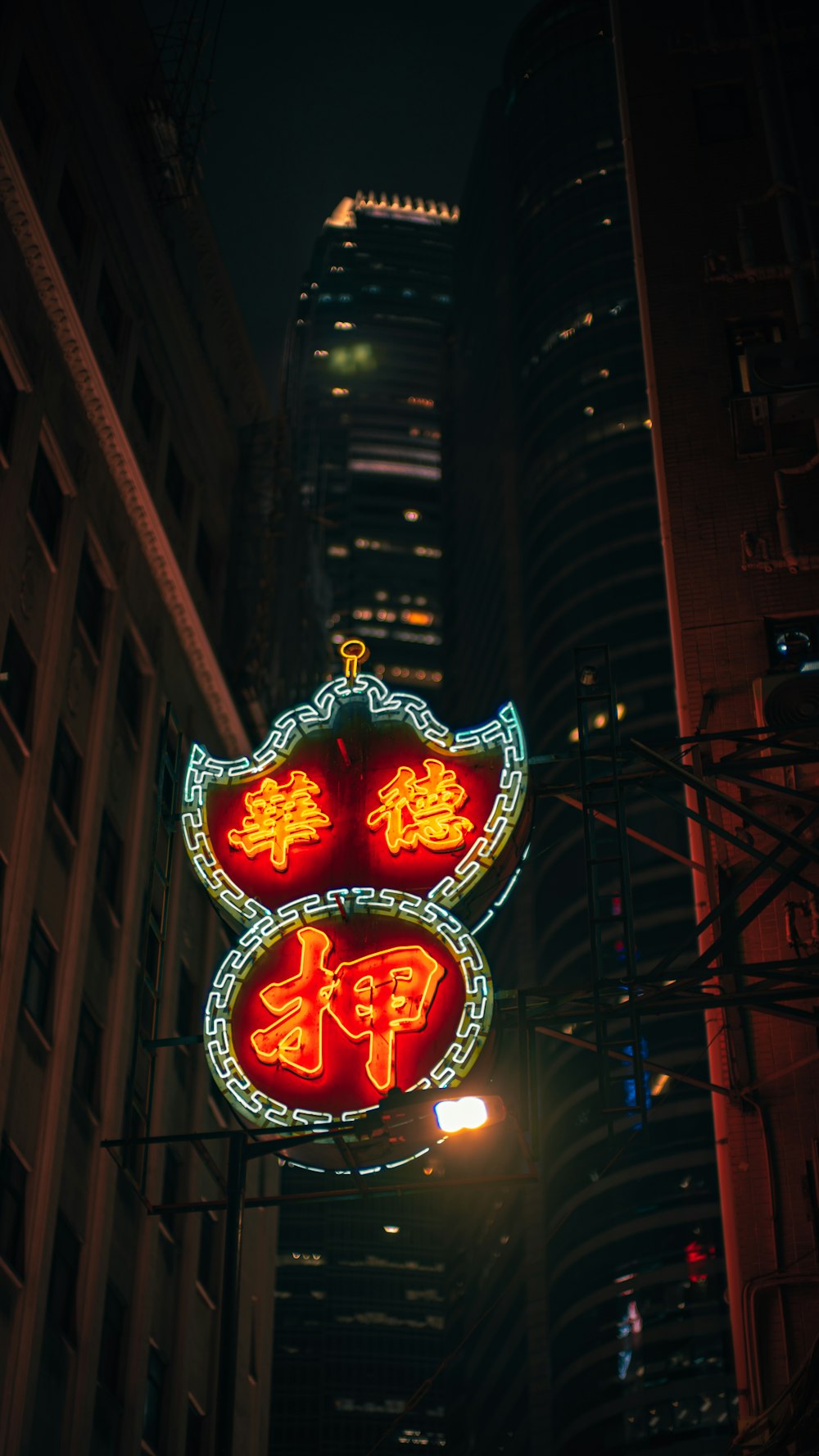 a lighted sign in a city
