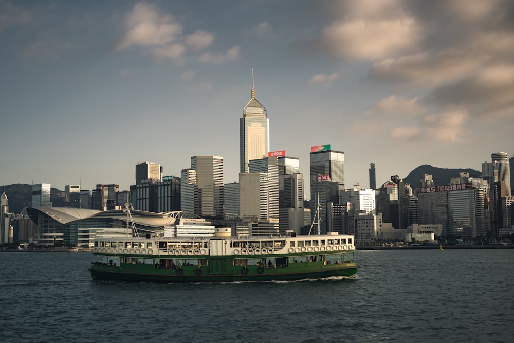 a boat in the water with a city in the background