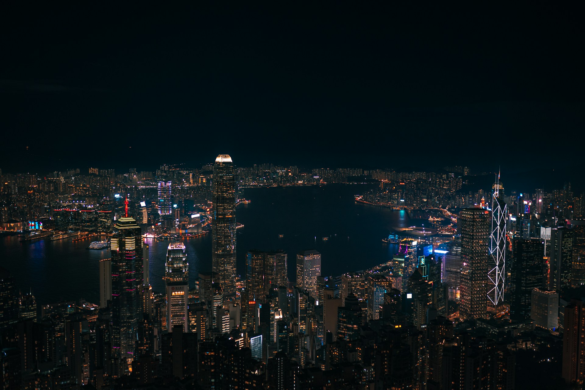A bustling city skyline at night with lights.