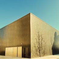 Exterior shot of the clean, contemporary diela manufacturing facility bathed in morning light.