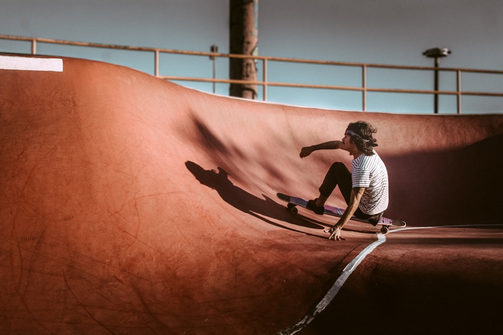 a man riding a skateboard at a skatepark