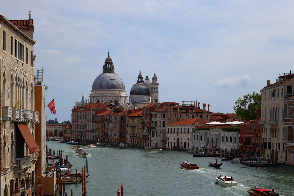 a river with boats and buildings along it